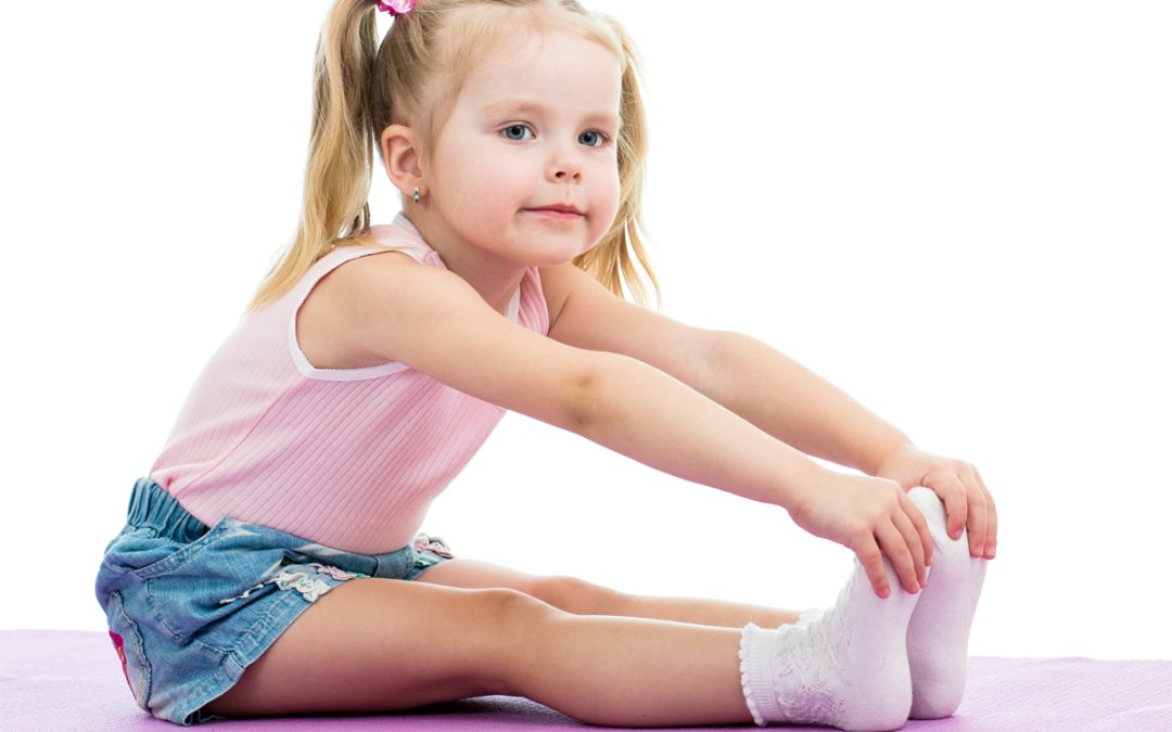 Child girl doing fitness exercises