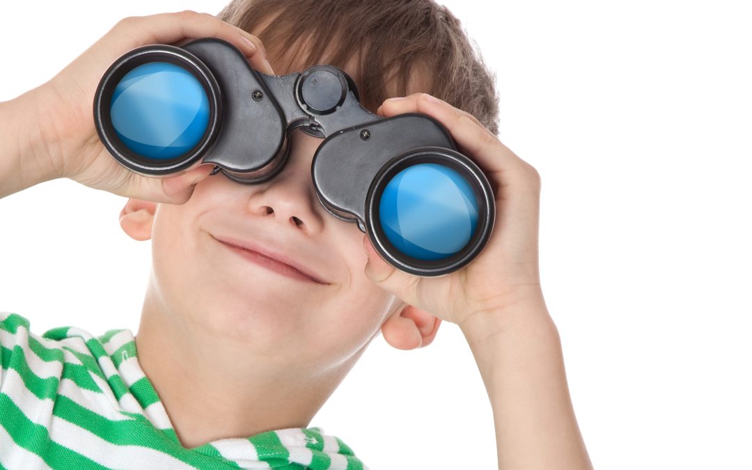 Boy holding binoculars
